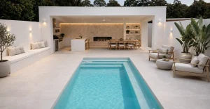 Modern fibreglass pool with wide entry steps, bench seating and a contemporary outdoor entertaining area